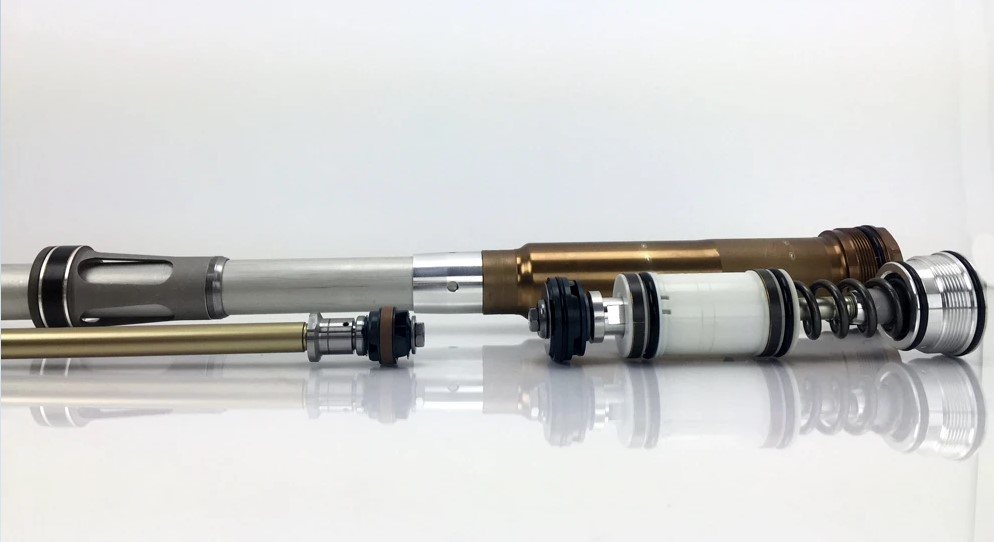 KYB-style motorcycle fork cartridge removed for inspection and service