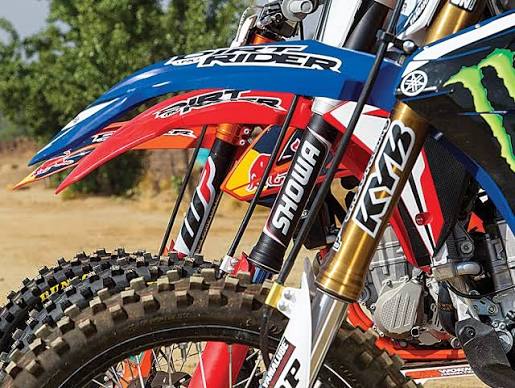 Motocross bikes showing WP, Showa and KYB upside-down front suspension forks
