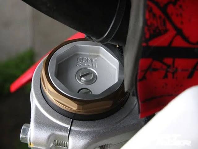 Adjusting compression and rebound clickers on dirt bike suspension